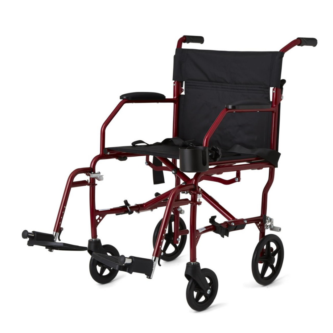 The Medline Ultralight Transport Chair, weighing only 15 lbs, features a durable red and black aluminum frame with four small wheels, armrests, a cup holder, foot supports, and a black fabric seat and backrest—offering practicality and style.